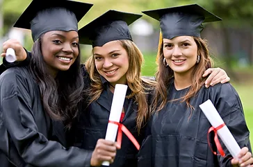 3-college-students-in-gowns-at-graduation-ceremony